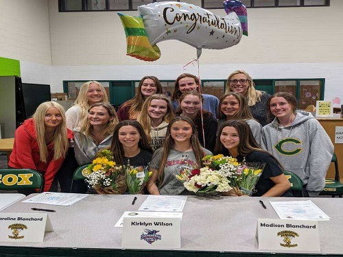 SENIORS CAROLINE BLANCHARD (front left), Kirklyn Wilson (front center), and Madison Blanchard (front right) signed their letters of intent to play girls soccer in the fall. The Blanchard twins will play at Randolph-Macon and Wilson will play at Lynchburg College.