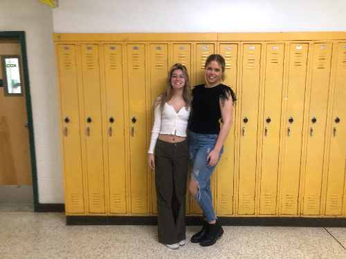 SENIORS EVALINA KOUFOU (left) and Emily Nuckols begin to incorporate warmer-weather clothing into their wardrobes. Students throughout the schools halls are breaking up with their winter attire for more spring-like, vibrant fashion. 