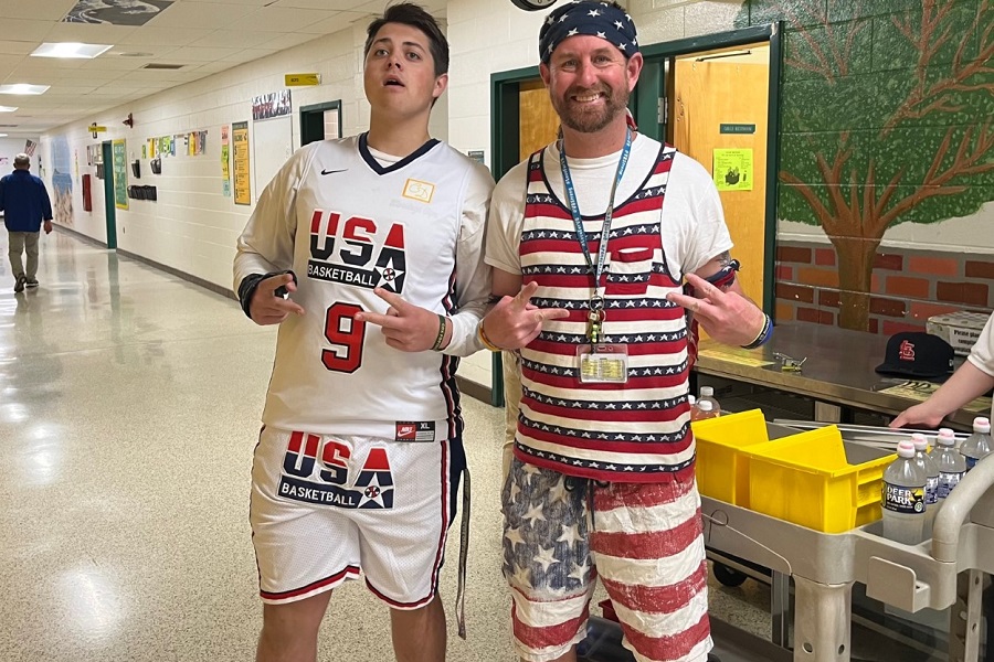 JUNIOR AIDEN CLARK (left) and teacher assistant Mr. Harrington sport U.S.A. gear on the first day of spring spirit week. The day is entitled Merica Day and offers faculty, students, and staff the opportunity to show love for the country.