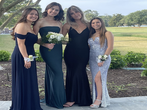 FALCONS SOPHOMORES CATHY Paulson (left), Maya Athey, Emma McCormack, and Annie Stephenson show their Ring Dance style. They each show off different popular dress styles this season.