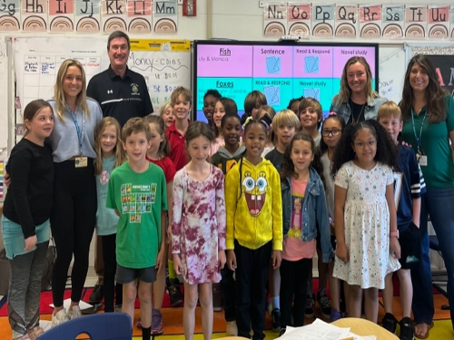 SENIOR PEYTON WILSON celebrates alongside her VTFT internship class and cooperating teacher Ms. Bauer at Linkhorn Elementary. She wont be out of the classroom for long as she was granted a teaching contract with VBCPS after college. 