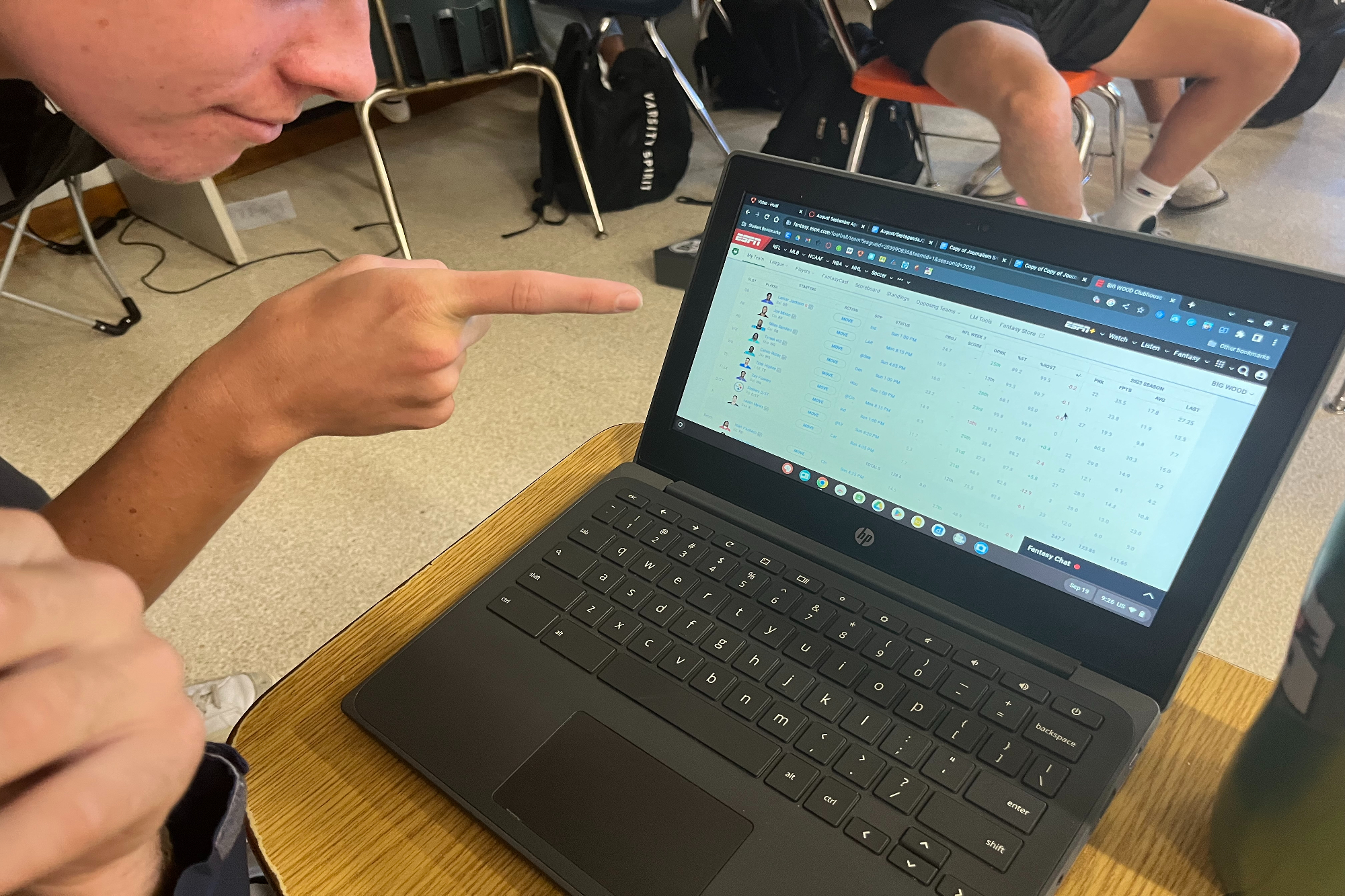 JUNIOR MAXWELL PALMERTON looks over his fantasy football squad deciding who to put on his team.  I think my team is the best in the league, Palmerton said.