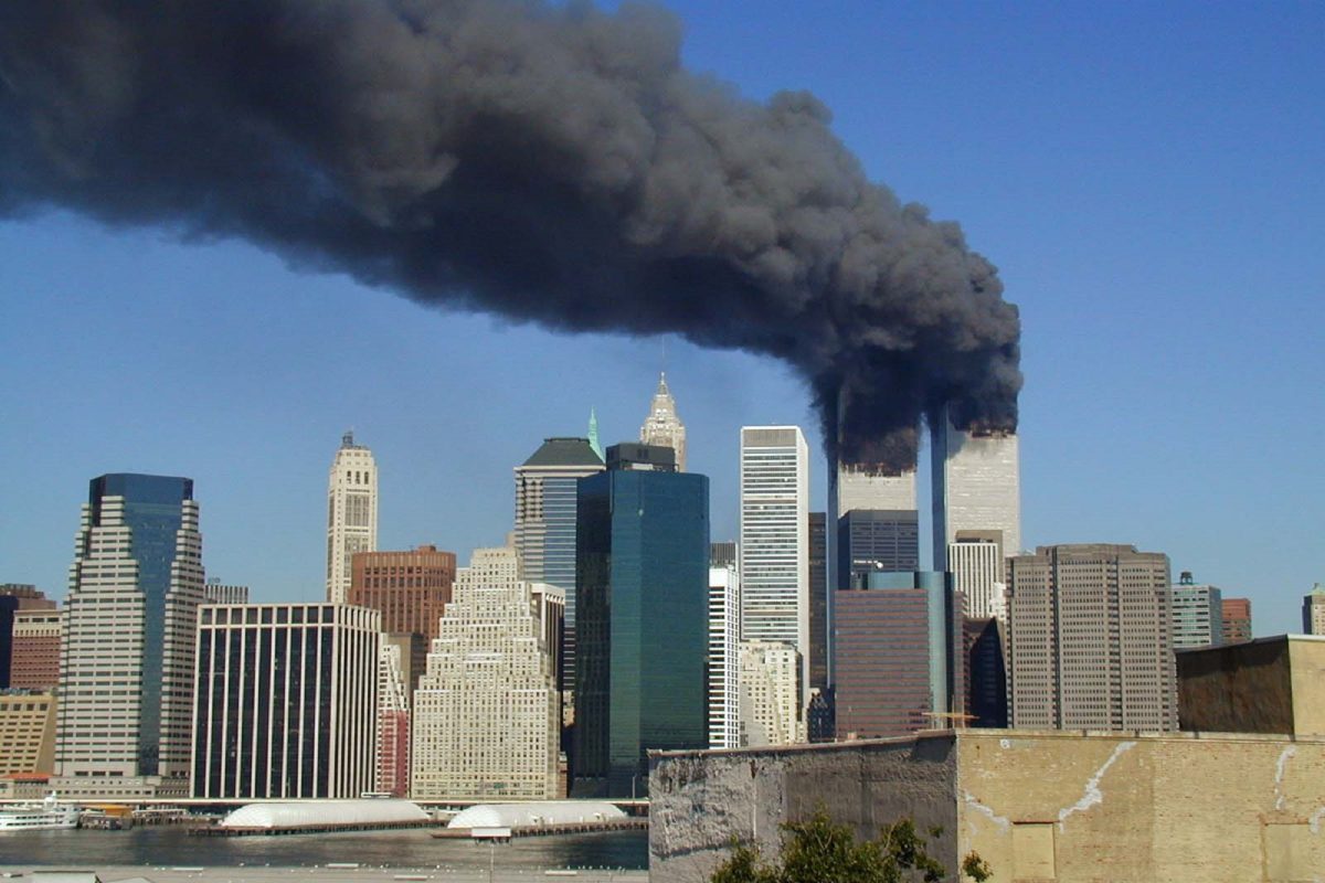 PLUMES OF SMOKE billow from the World Trade Centers twin towers on September 11, 2001. Two of the hijacked airplanes were flown directly into the buildings, ultimately causing both buildings to implode.