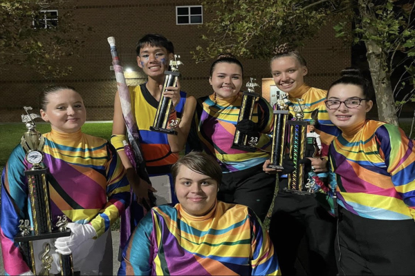 MARCHING FALCONS BAND celebrates their many victories, proudly showing off their trophies. Despite the bands small numbers, they once again placed first in almost all categories.