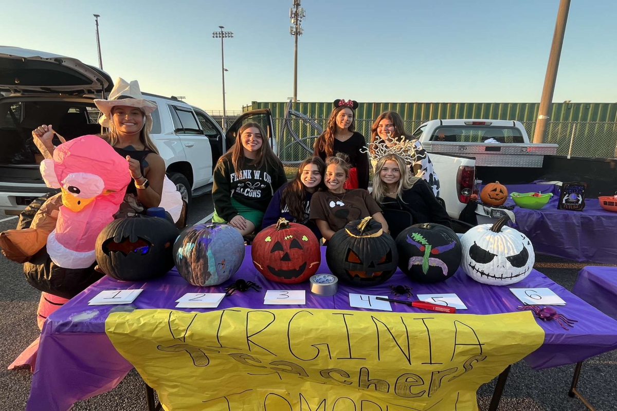 VIRGINIA TEACHERS FOR Tomorrow  passed out candy in the junior parking lot at Boo Bash. Many of the schools clubs and sports teams participated in the the event, so there was plenty of candy and fun games for kids as they walked around the lots in a variety of cool costumes.