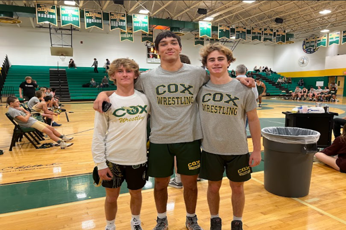 JUNIORS Aiden Dougherty, Ethan Merullo, and Noah Gomez celebrate their wins in their first wrestle off for starting positions.