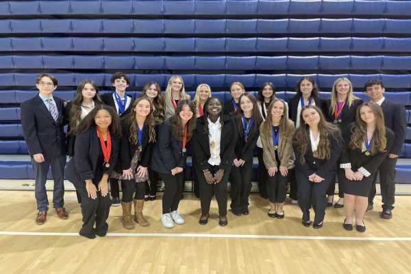 CHS DECA students compete at the DECA District Competition. 49 medals were won , with 12 students qualiying for states. 
