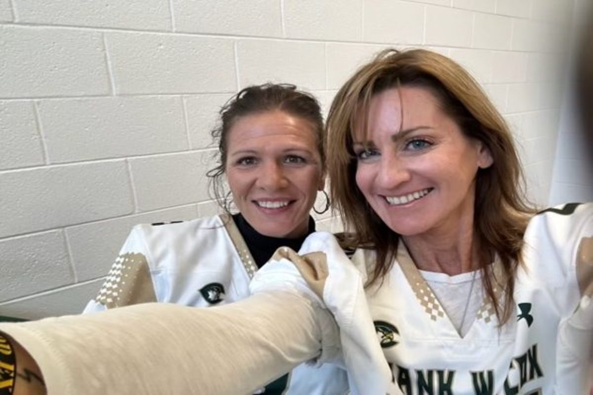 HONORS ENGLISH 11 teacher Lora Marlar (left) and Journalism sponsor Erin Tonelson (right) celebrated football senior night by wearing a jersey given to them by a senior player. Marlar has made a positive impact on her students and co-workers. 