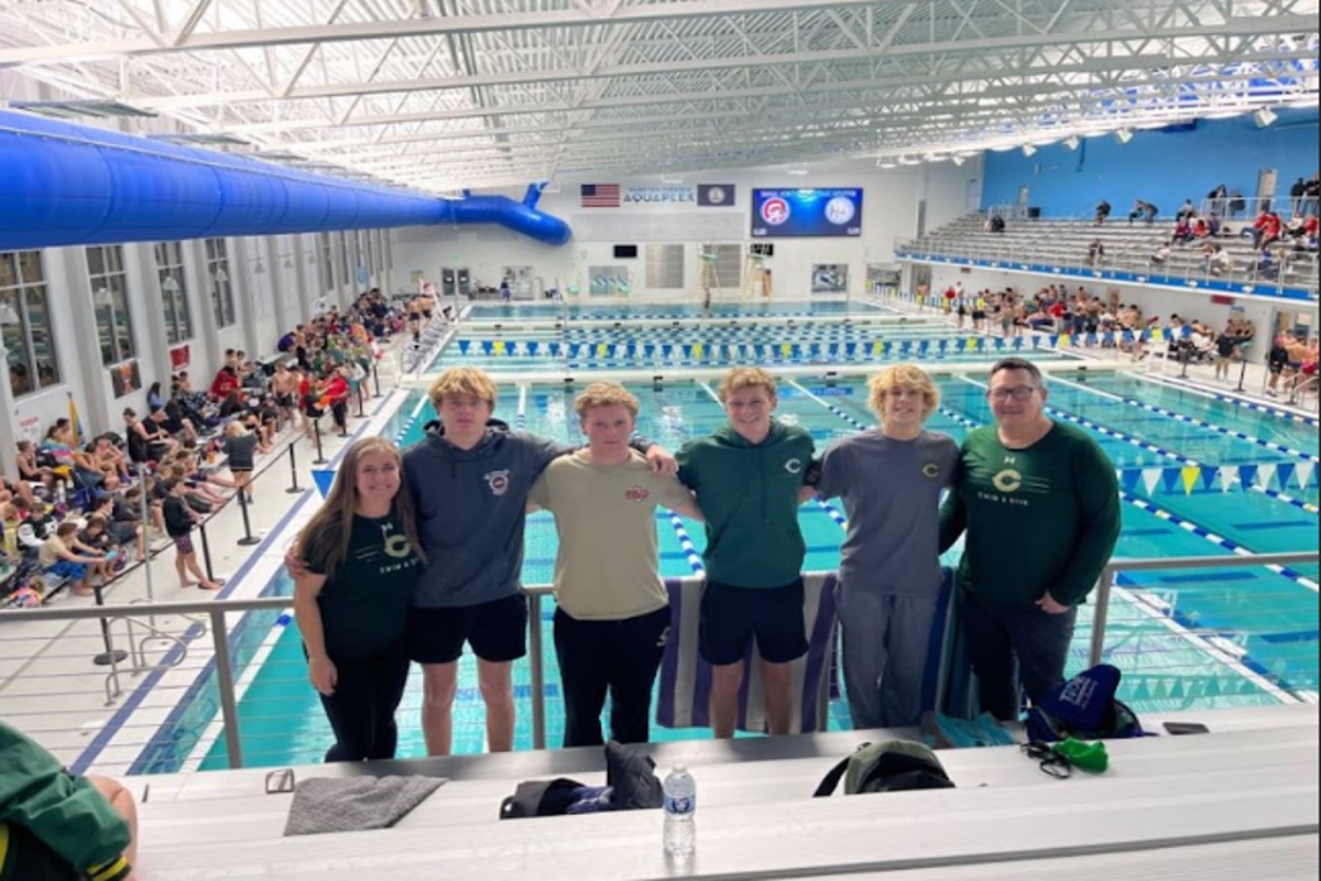 VARSITY BOYS SWIM team members  finished their invitational race with the support of Coach Pierce and Coach Kwiatkowski. The team competed at Aquaplex in Hampton, to not only showcase their talents to other schools in the region., but to move up the ranks.