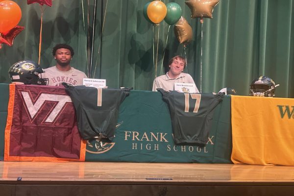 SENIOR STUDENT-ATHLETES Gerard Johnson (left) and Sam Braidwood signed letters of intent recently to continue their football careers at their chosen colleges/universities. Johnson will attend Virginia Tech beginning this month, while Braidwood will attend William & Mary in the fall.