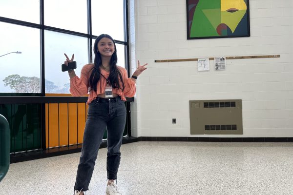 SPRING FASHION FILLS the Falcon hallways as students eagerly await warmer weather and the  fun styles debuted by students. Junior Grace Lindauer  was seen wearing the color of the year Peach Fuzz, on a ruffled blouse. 