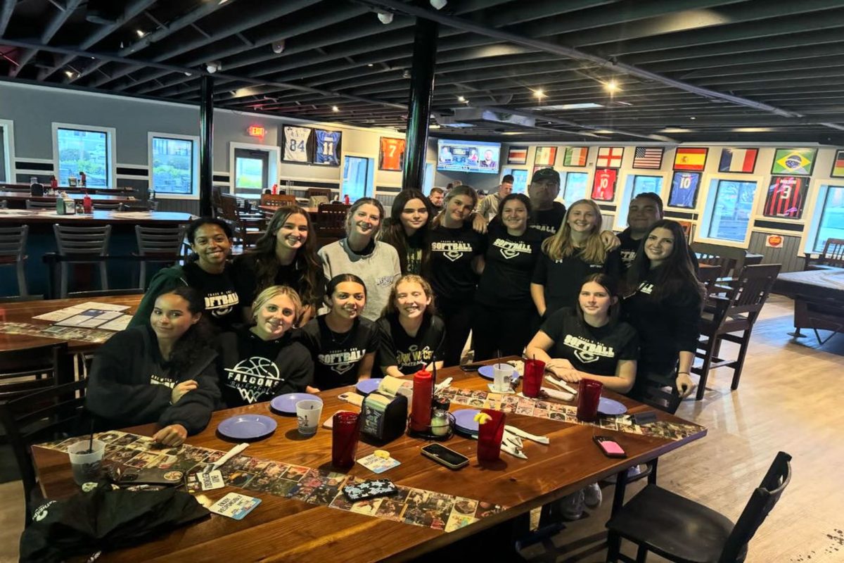 THE+LADY+FALCONS+enjoy+a+team+dinner+after+a+win+against+the+Marlins+of+Bayside+High+School.+Locally+owned+Shorebreak+Pizza%2C+is+a+local+restaurant+that+often+hosts+teams+in+the+area.++Softball+joined+the+celebratory+ranks+after+their+sixth+straight+win+of+the+season.