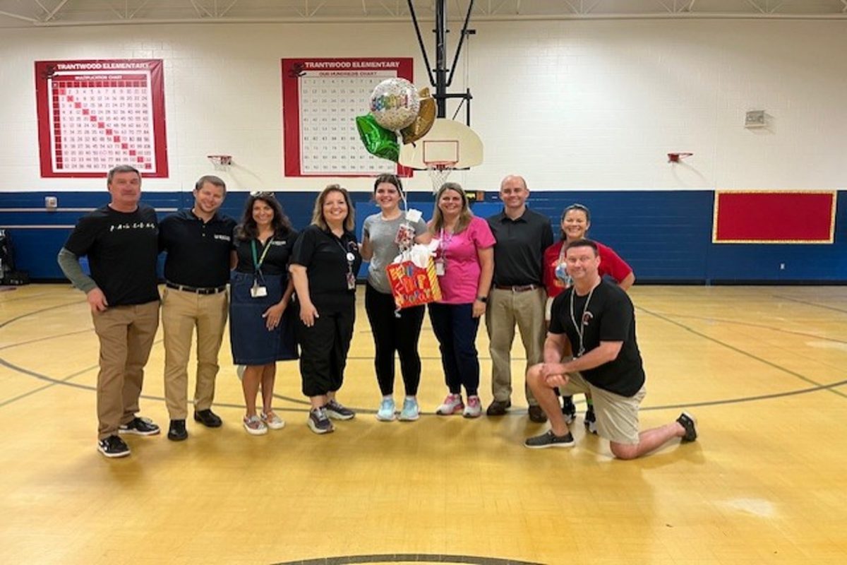 SENIOR VTFT II student Rachel Fox celebrates earning her future VBCPS teacher contract through her work in her VTfT class over the past two years. Her teacher contract will help her secure a teacher job after college. 