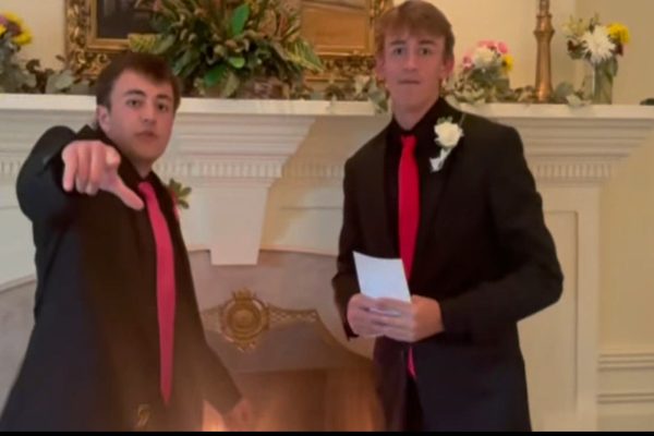 SENIORS MAX PALMERTON (left) and Blake Heselius break down their final food review of the school year.  Palmerton and Heselius took their dates, pre-Ring Dance, to the Princess Anne Country Club before attending the festivities.