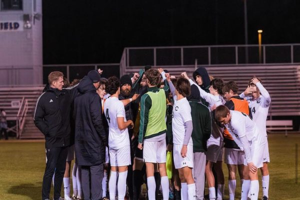 COACH RIPA CELEBRATES his victory against Ocean Lakes High School two weeks ago. The Falcon boys outplayed their opponent, winning 2-0. 