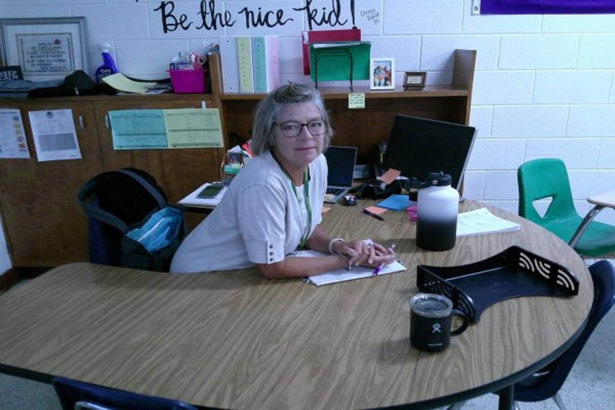 AP STAT AND Pre-Calc teacher Mrs. Noe sits at her desk and reflects on the day. "Although teaching can be overwhelming, " Noe said. "It's well worth it." 