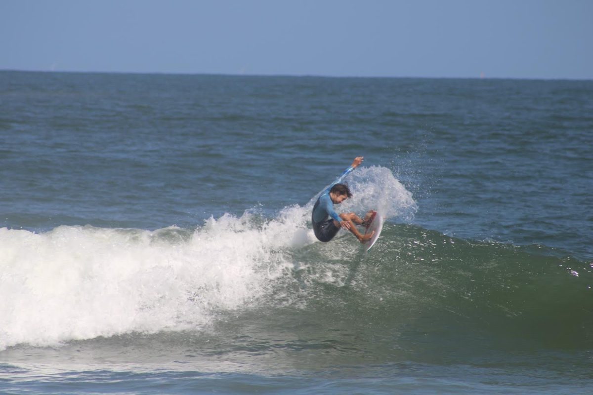 LOCAL SURFER RIDES a wave at the Oceanfront. He is hitting a "snap", or turning at a 90 degree angle. 