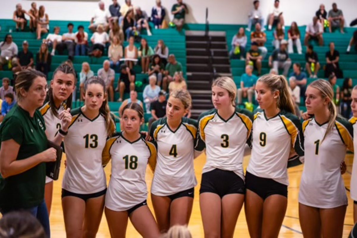 FALCON GIRLS VOLLEYBALL huddles to discuss strategy in their recent match against First Colonial High School. The game plan they created led to a 3-1 victory.