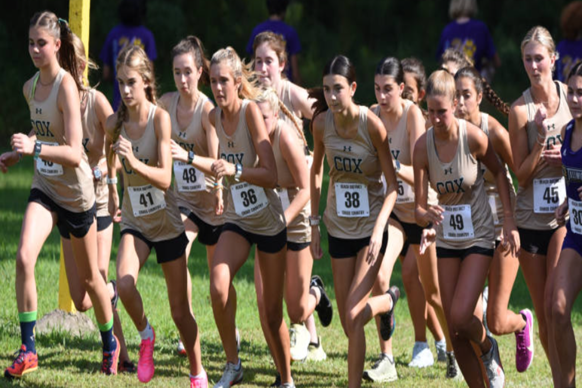 SOPHOMORE DANIELLE MANOR sets the pace in the two mile meet against the First Colonial Cross Country team. The Falcons turn it up to take the lead.