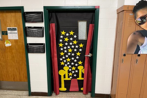 MRS. NARDELLI'S DOOR shares photos of her former students, complete with their name and year of graduation. More decorations will show up as the week progresses. 