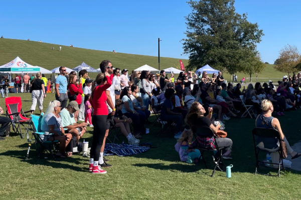 EXCITED PARENTS FILM their children singing and dancing along to the princess performance. The princesses and bounce castles were a hit this year.