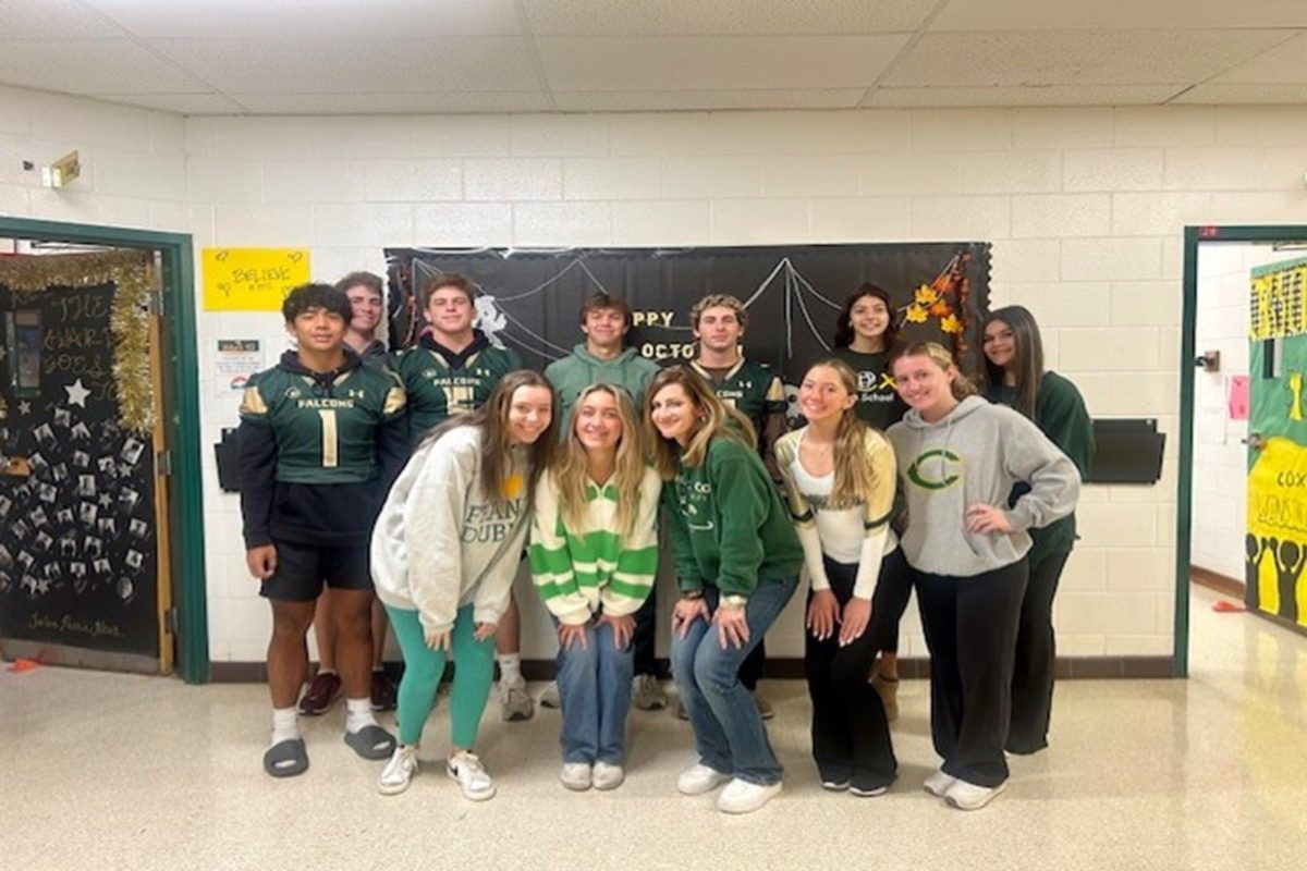 JOURNALISM STUDENTS FLAUNT their school spirit in gold and gold in preparation for the pep rally.  The Falcons had a successful Homecoming week, ultimately winning the football game.