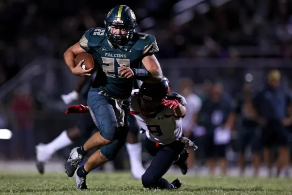 SENIOR MAX PALMERTON rushes for a touchdown against Bayside earlier in the season. Palmerton has led the rushing attack all year for the Falcons. 