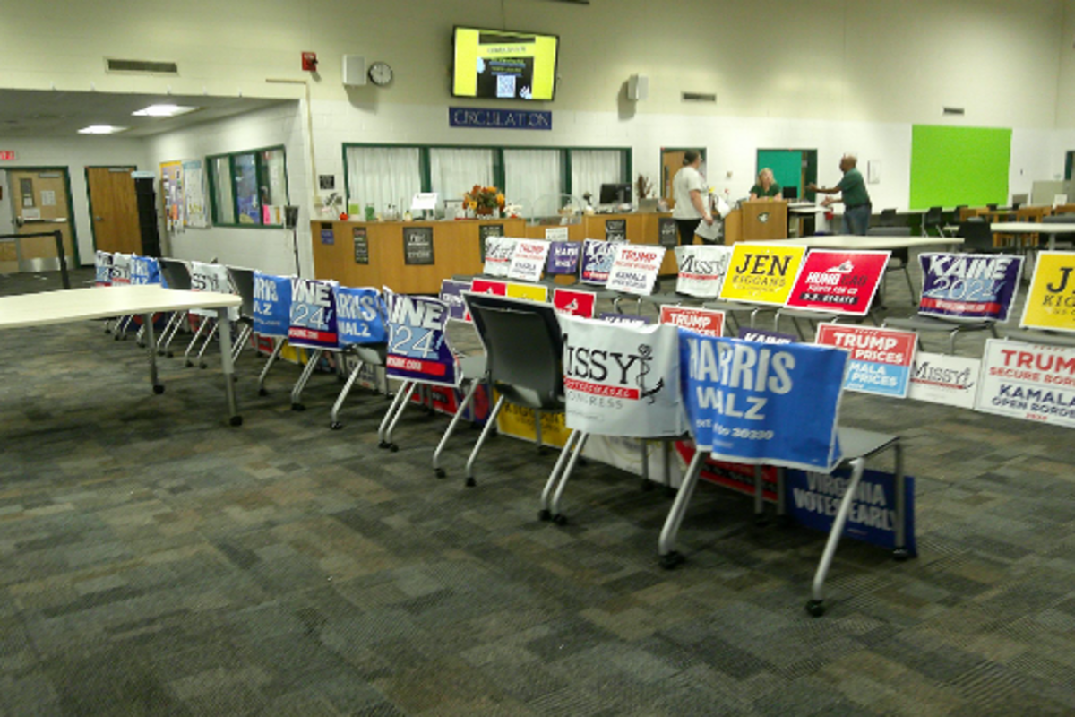 GOVERNMENT TEACHERS SET up a mock election for students to practice voting. Government students have been working on a project to help convince each other which candidates to vote for. 