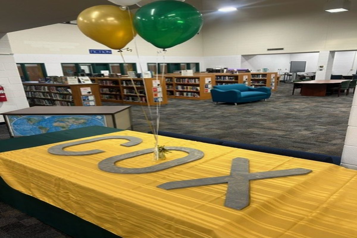 HEAD FIELD HOCKEY Coach and Head Baseball Coach prepared the space for the event in the back of the library last week. Signing day was a success thanks to both coaches' help.