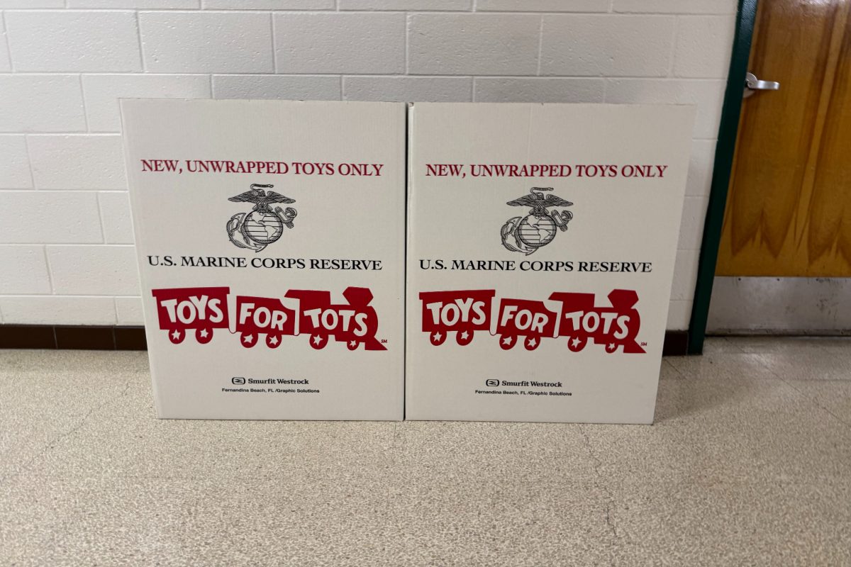 CHS STUDENTS PLACE toys in "Toys for Tots" collection bins around the school. The toys will be collected by the US Marine Corps before the holidays.