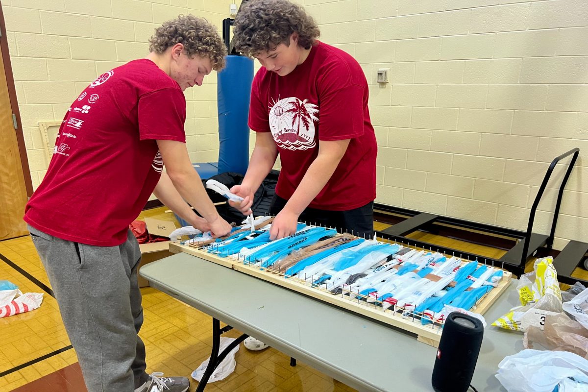 (LEFT) SENIOR VIRGINIA Teachers for Tomorrow II students senior Cole Ludford (left) and junior Braeden McQueen created beds for PiN.   Ludford and McQueen assembled these beds in effort to help the homeless community in Hampton Roads.