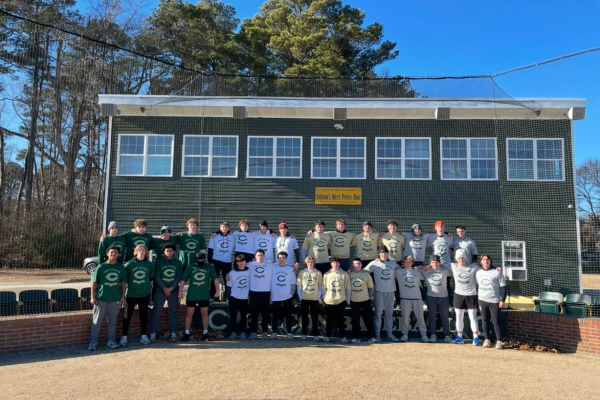 CHS VARSITY BASEBALL players line up in anticipation  behind the backstop before the annual Iron Falcon Challenge. Boys are split into teams to complete a variety of fitness competitions; Team Gray won this year.