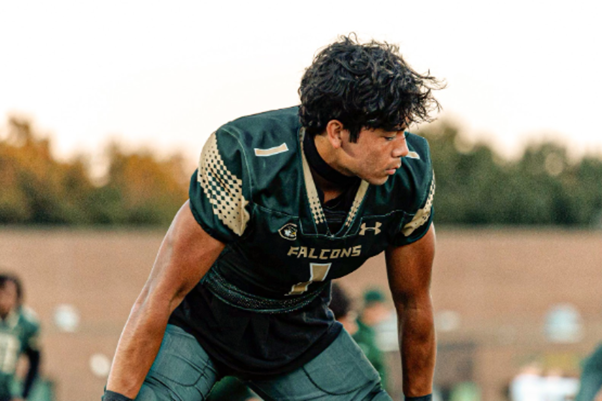 SENIOR CARTER RODRIGUEZ mentally prepares himself for this past season's game against the Lions of Tallwood High School.  The Falcons secured the win, which advanced them in the season.