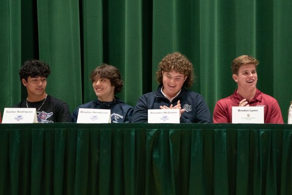 FALCON FOOTBALL PLAYERS joined field hockey, baseball, and a solo golfer to sign letters of intent in the auditorium on National Signing Day earlier this week.  Although some of these student-athletes signed in the fall, they were honored again, along with all of their peers.