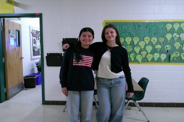 SOPHOMORES SYDNEY HAFTEL and Rose Holland sport their matching navy blue sweaters paired with blue jeans. Sydney's french braided hair has been seen more often in the CHS hallways.