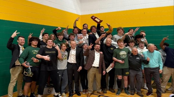 PAST AND PRESENT Falcon wrestlers celebrate their Class 5A win this past weekend, 50 points ahead of Kellam and Great Bridge High Schools who tied for 2nd place. The wrestling program has brought back the winning tradition with back-to-back state championship wins.