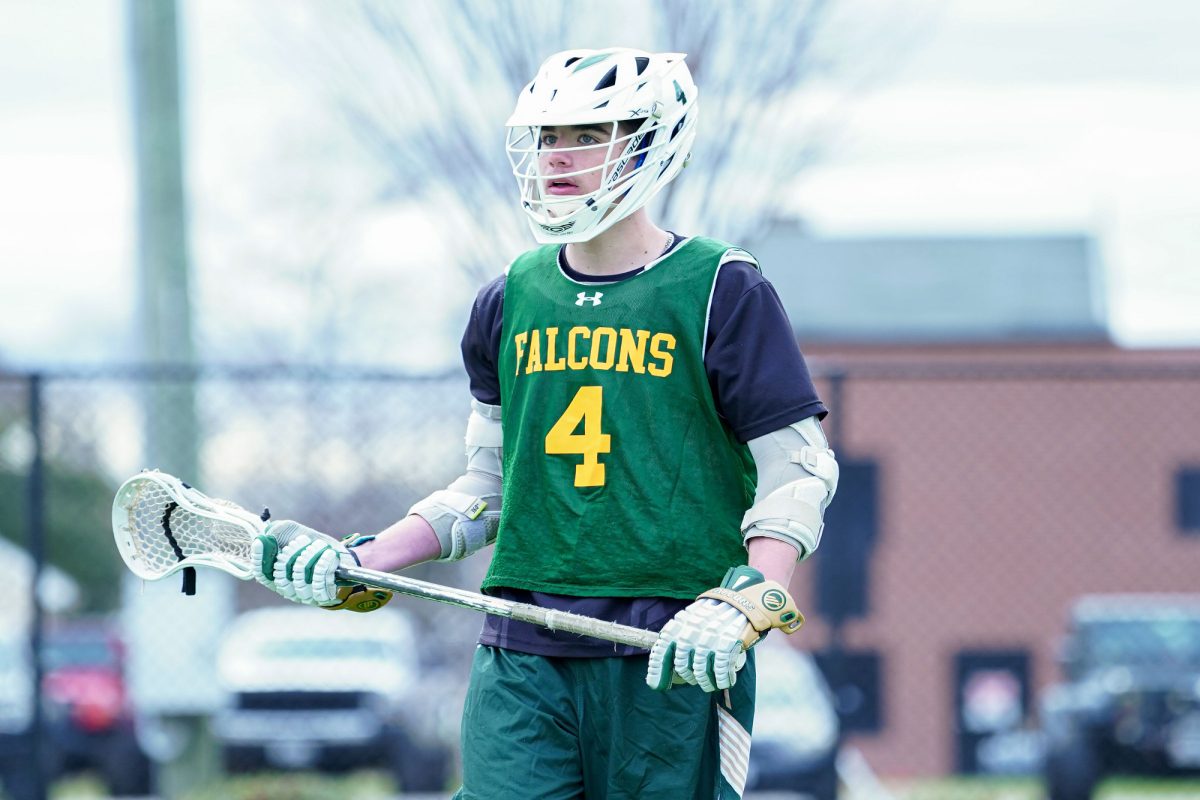 SENIOR CURTIS BARTHOLOMEW stays on high alert while playing defense. The opponents are kept from scoring, thanks to Bartholomew's defense. 