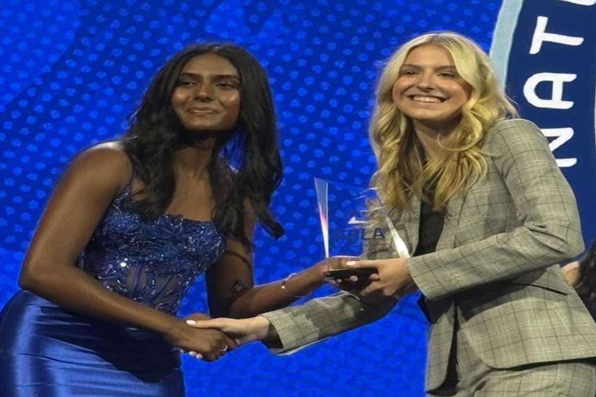 SENIOR MEGAN BRANNOCK (right) accepted an award on behalf of her dental office business plan. She placed 10th in the country at the Future Business Leaders of America (FBLA) nationals. 