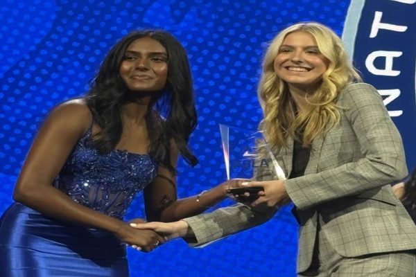 SENIOR MEGAN BRANNOCK (right) accepted an award on behalf of her dental office business plan. She placed 10th in the country at the Future Business Leaders of America (FBLA) nationals. 