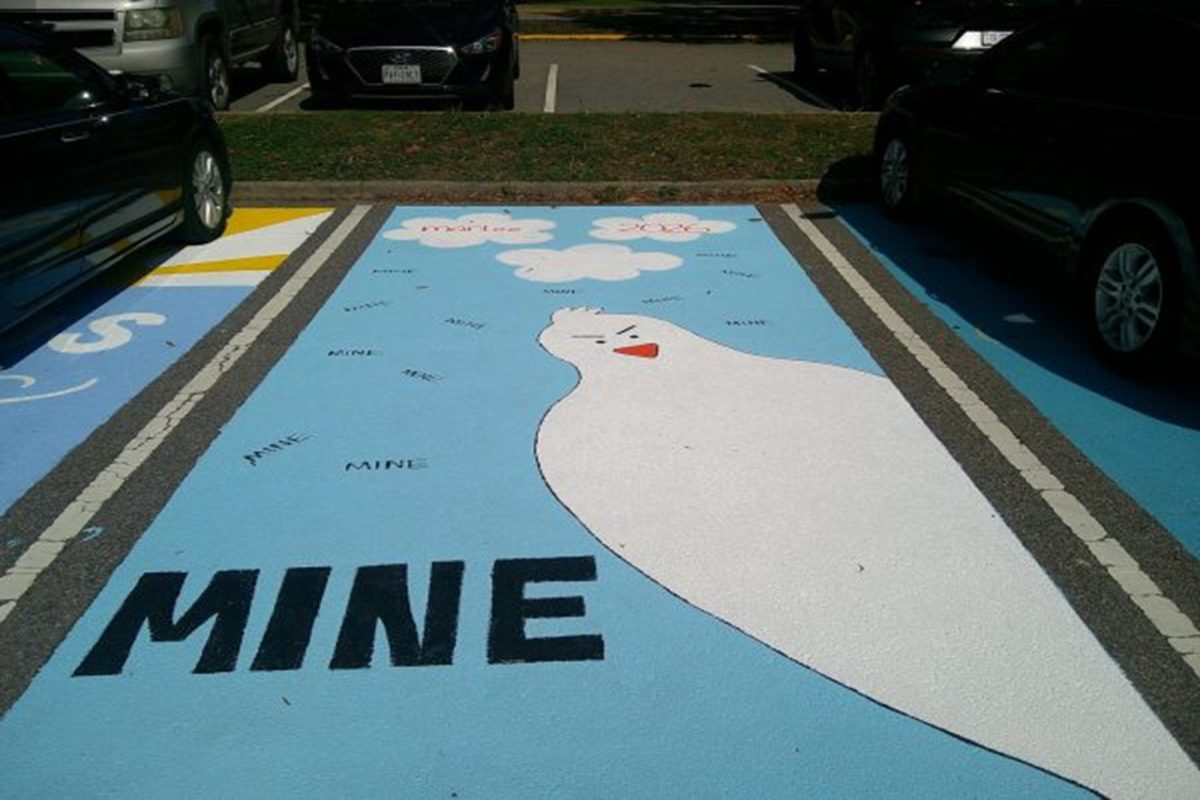 SENIOR MARLEE HANCOCK claims her designated parking space by painting this beautiful piece of work. The space is now hers for the rest of the year.