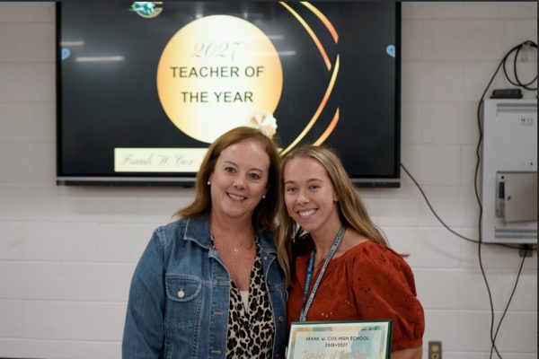 NEW PRINCIPAL MRS. George happily stands beside the newest Teacher of the Year, Bailee Meekings. Only having taught for seven years, Meekings has made a huge difference at CHS.
