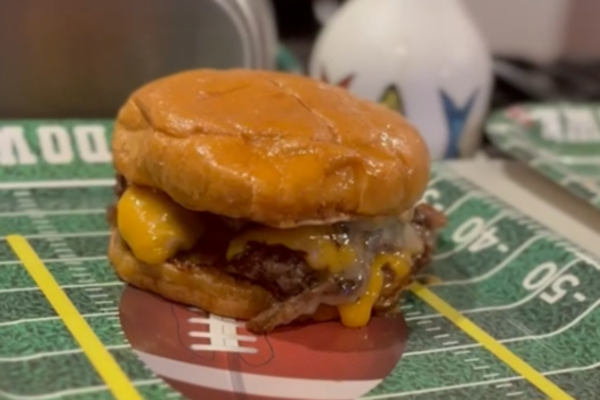 Chef Levy; sizzling smash burgers hit the grill.