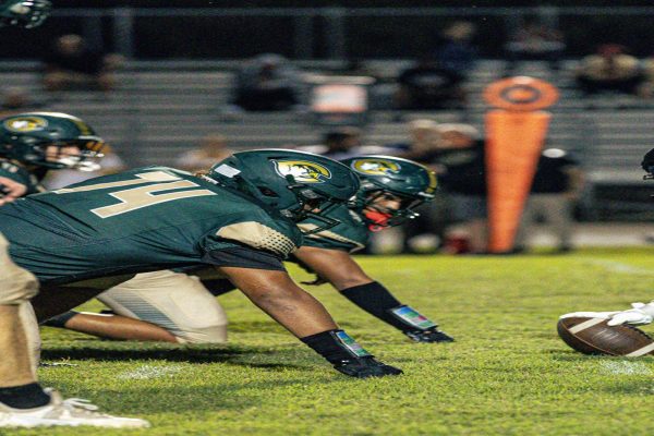 FALCON FOOTBALL DEFENSE lines up against the Salem SunDevils just before their offensive line is dismissed. The Falcons not only upended the Beach district's balance of power, but broke some records in the process.