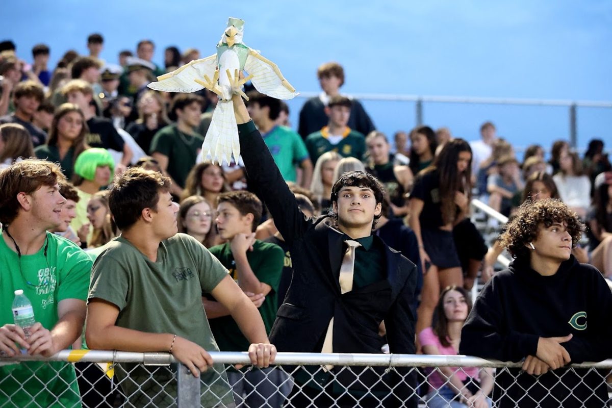 JUNIOR TOMMY TORBERT brings up the energy at the fall pep rally. Students and staff prepared to celebrate the annual Homecoming game and all the fun and excitement it offers.. 