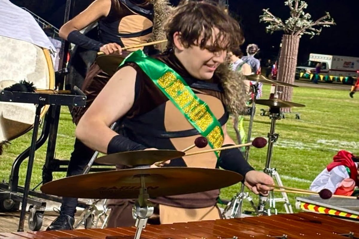 SENIOR NOAH GOODMAN pounded the drums during the halftime show at the football game. Goodman had created a rhythm for others to follow. 