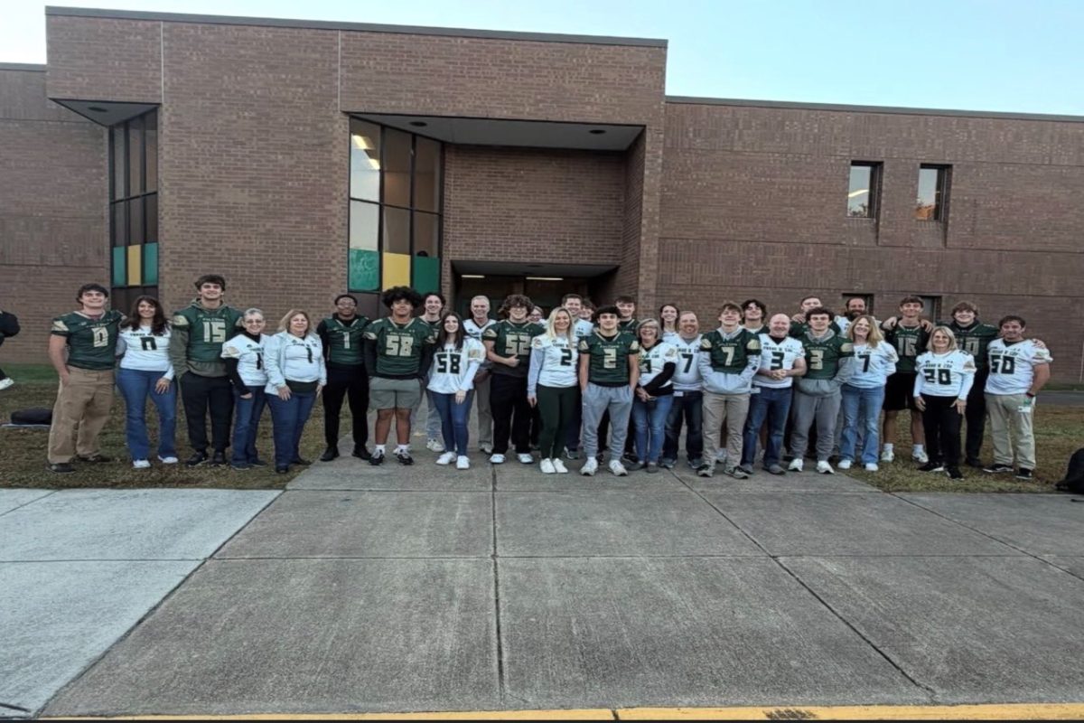 SENIOR FOOTBALL PLAYERS gave their jersey as a sign of respect to their favorite teachers ahead of the senior night game. The Falcons would later honor these teachers and the rest of the school by solidifying their place in the first playoff game. 