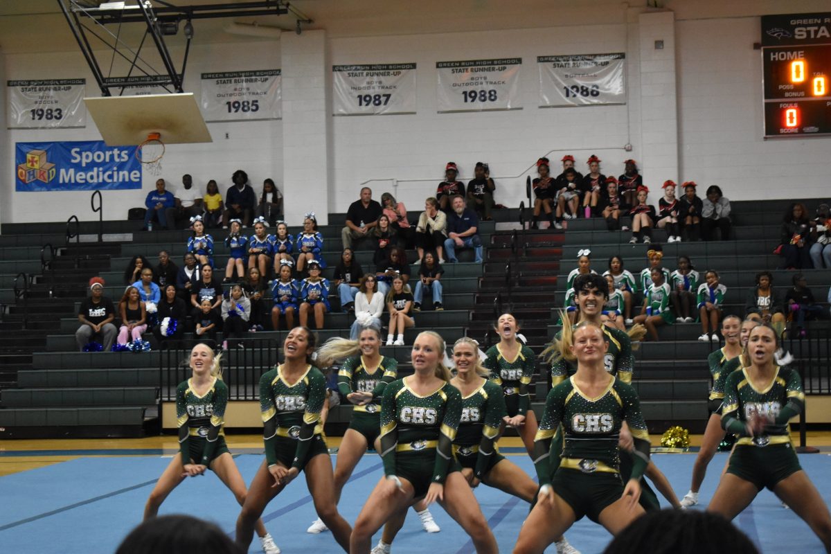 LADY FALCON COMPETITION cheer team feels the beat as they perform for judges at the state competition last week. The team was rocking the house and they left it all on the floor.