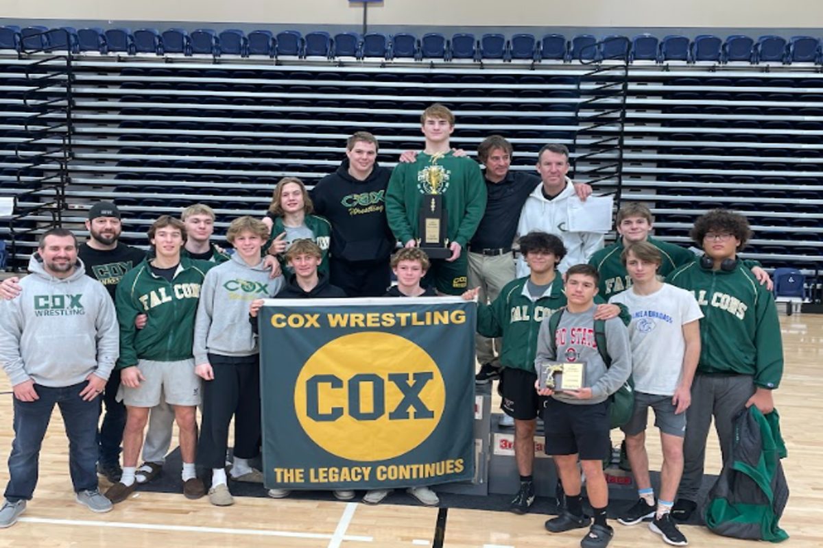 CHS WRESTLERS CELEBRATE one of their big wins last season at the Richmond Invitational. The Falcons dominated other wrestling programs, scoring the most points at the tournament. 