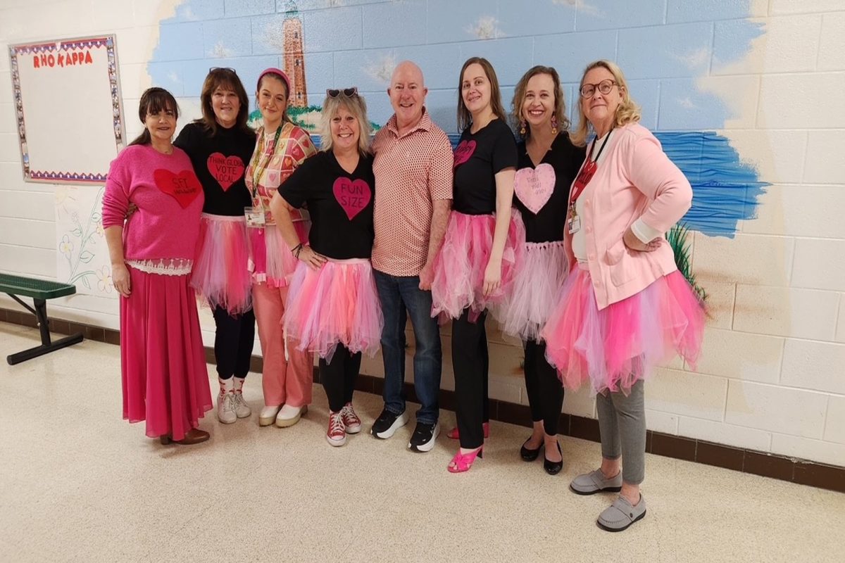 SOCIAL STUDIES TEACHERS display their pink and red ensembles on the last day of the CHKD Love/Run Walk for a Cure spirit day.  These teachers are not scared to show off their tutus.