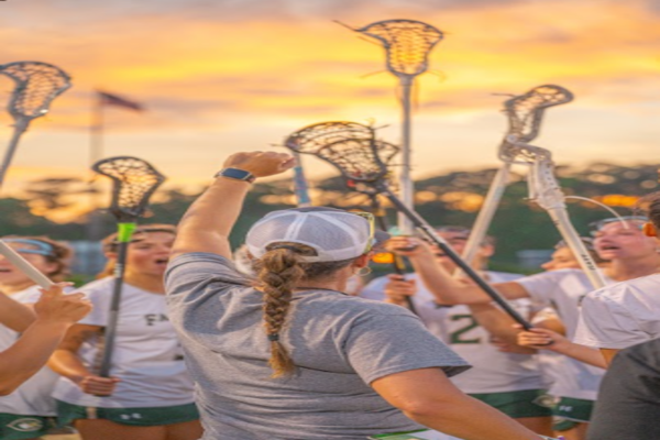 LADY FALCON LACROSSE players amp up before taking the field at an away match. The lacrosse team has upped the ante over the past few weeks, bringing themselves back into the top six.